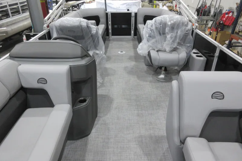 Slide: The Image of 2026 Sun Tracker Party Barge 22 DLX interior with gray seating and modern design. - 3