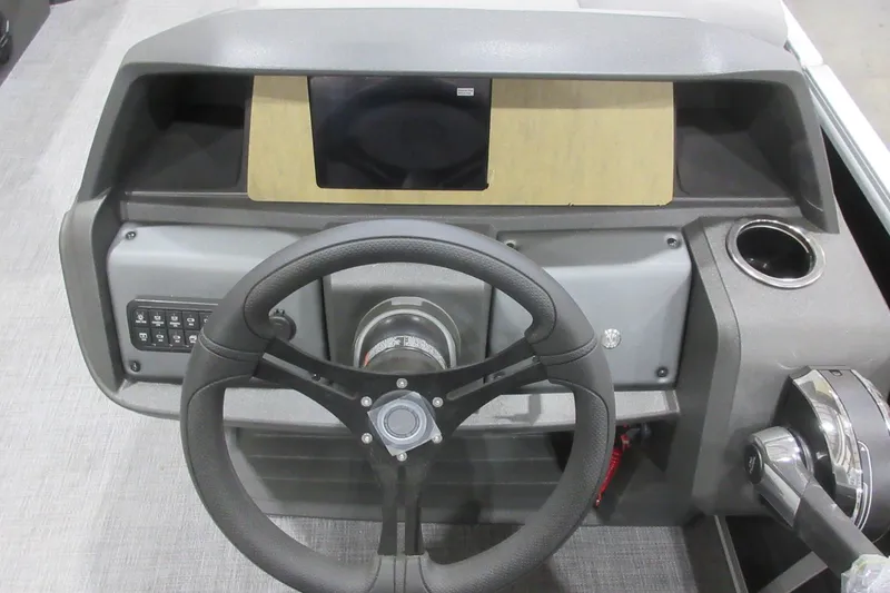 Slide: The Image of Steering console of 2026 Sun Tracker Party Barge 22 DLX with modern controls. - 5