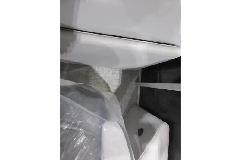 Slide: The Image of Interior view of 2026 Sun Tracker Party Barge 22 DLX, featuring seating and flooring. - 6