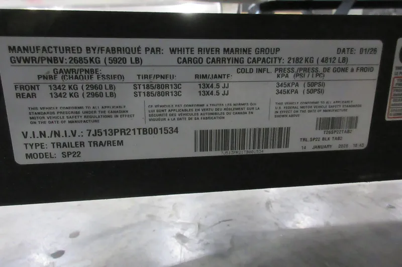 Slide: The Image of Sun Tracker Party Barge 22 DLX 2026 trailer label with specifications and VIN details. - 8