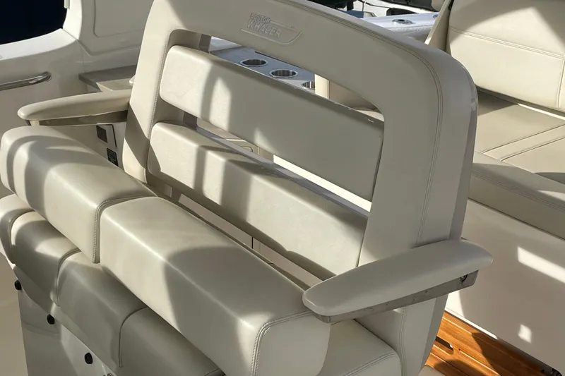 Slide: The Image of Luxury seating on 2022 Boston Whaler 350 Realm boat, featuring elegant beige upholstery. - 16