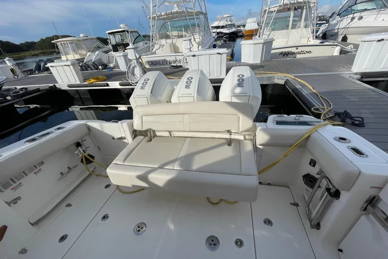 Slide: The Image of Boston Whaler 350 Realm 2022 boat with triple outboard engines at marina. - 20