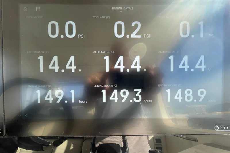 Slide: The Image of Display screen showing engine data for a 2022 Boston Whaler 350 Realm boat. - 7