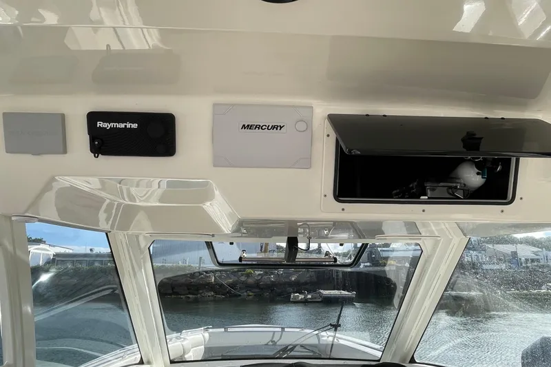 Slide: The Image of Interior view of 2022 Boston Whaler 350 Realm boat with Raymarine and Mercury equipment. - 8