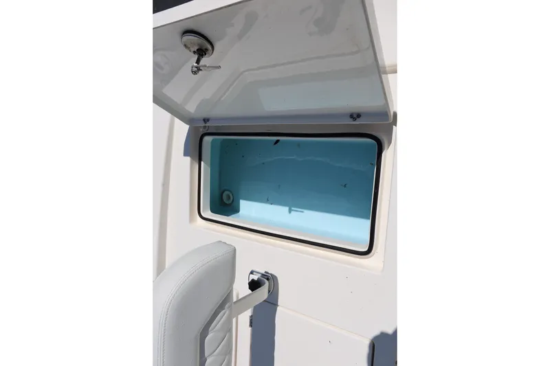 Slide: The Image of Open storage compartment on 2024 Pathfinder 2300 HPS boat, featuring a sleek design. - 11