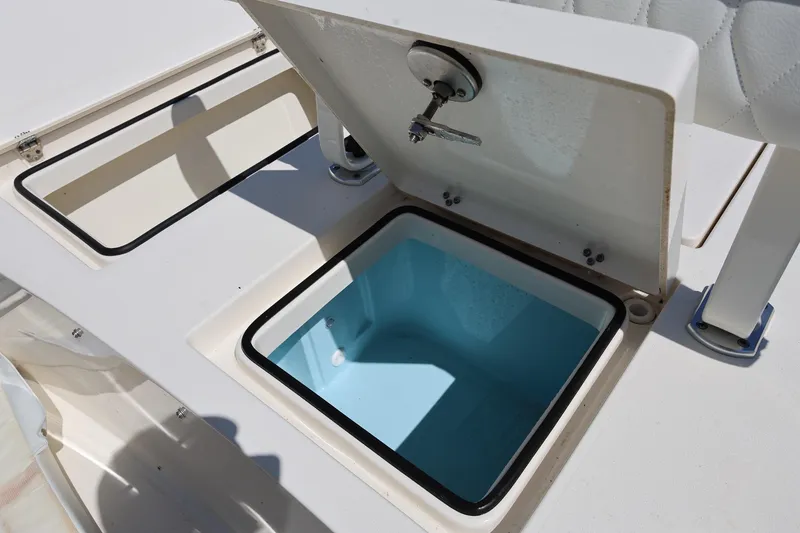 Slide: The Image of Open storage compartment on 2024 Pathfinder 2300 HPS boat deck. - 12
