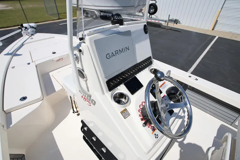 Slide: The Image of 2024 Pathfinder 2300 HPS boat console with Garmin navigation system and steering wheel. - 14