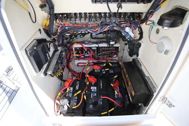 Slide: The Image of Electrical wiring and battery setup inside a 2024 Pathfinder 2300 HPS boat. - 24