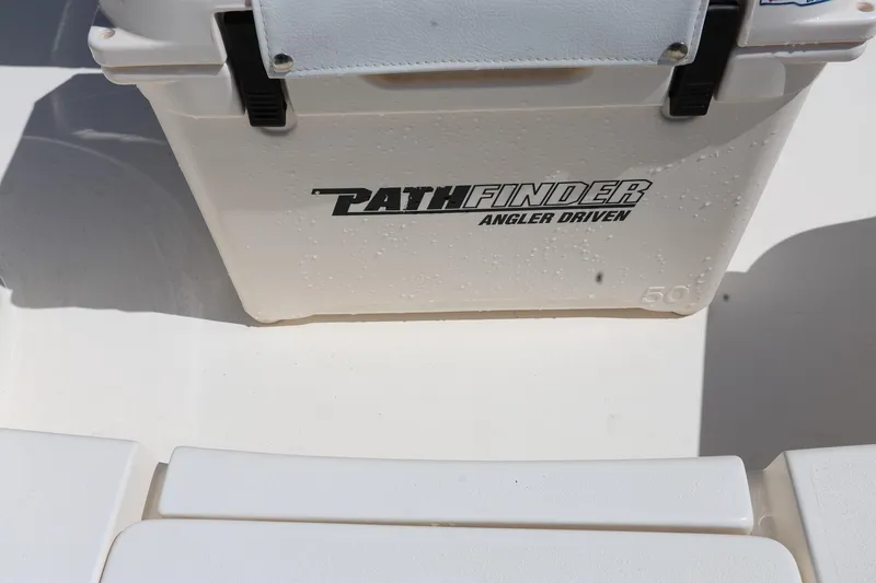Slide: The Image of 2024 Pathfinder 2300 HPS boat cooler with "Angler Driven" branding, wet surface. - 26