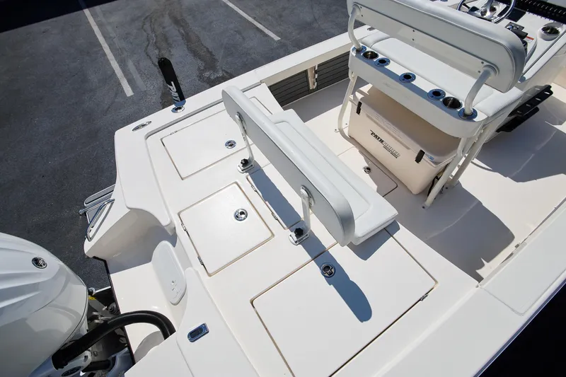 Slide: The Image of 2024 Pathfinder 2300 HPS boat interior with seating and storage compartments. - 5