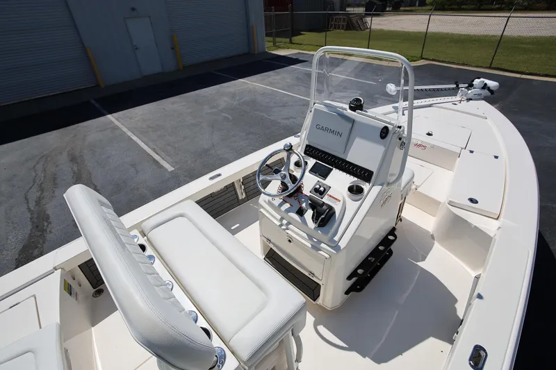 Slide: The Image of 2024 Pathfinder 2300 HPS boat interior with Garmin navigation system and seating. - 7