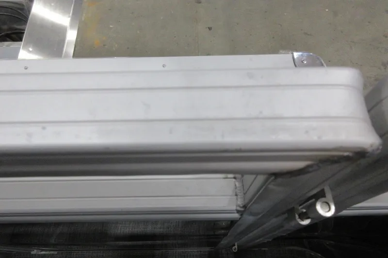 Slide: The Image of Close-up of 2026 Sun Tracker SportFish 22 DLX aluminum frame detail. - 10