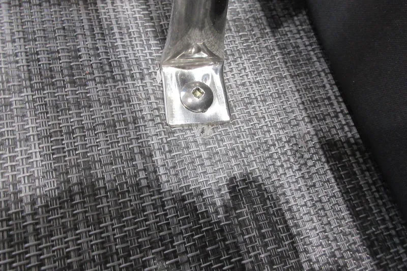 Slide: The Image of Close-up of Sun Tracker SportFish 22 DLX 2026 boat flooring and metal fixture. - 14