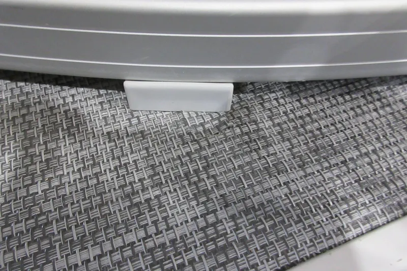 Slide: The Image of 2026 Sun Tracker SportFish 22 DLX boat flooring detail with textured pattern. - 19