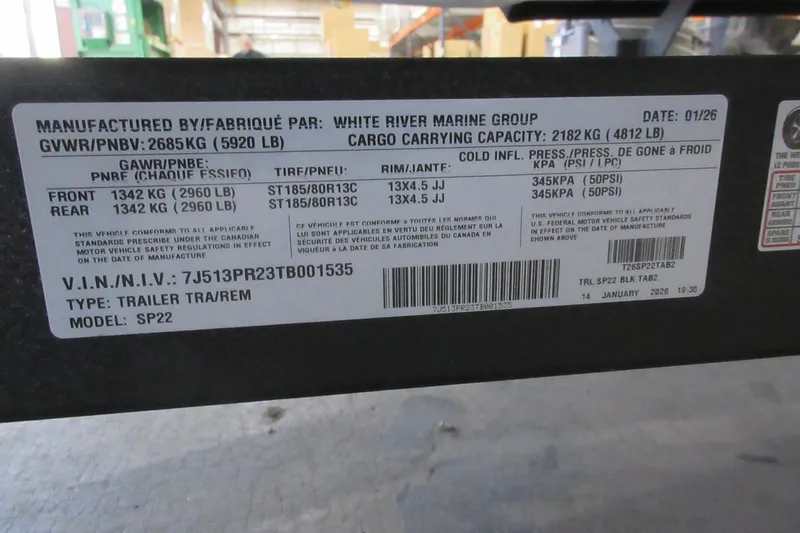 Slide: The Image of Label on Sun Tracker SportFish 22 DLX trailer, showing specifications and manufacturing details. - 21