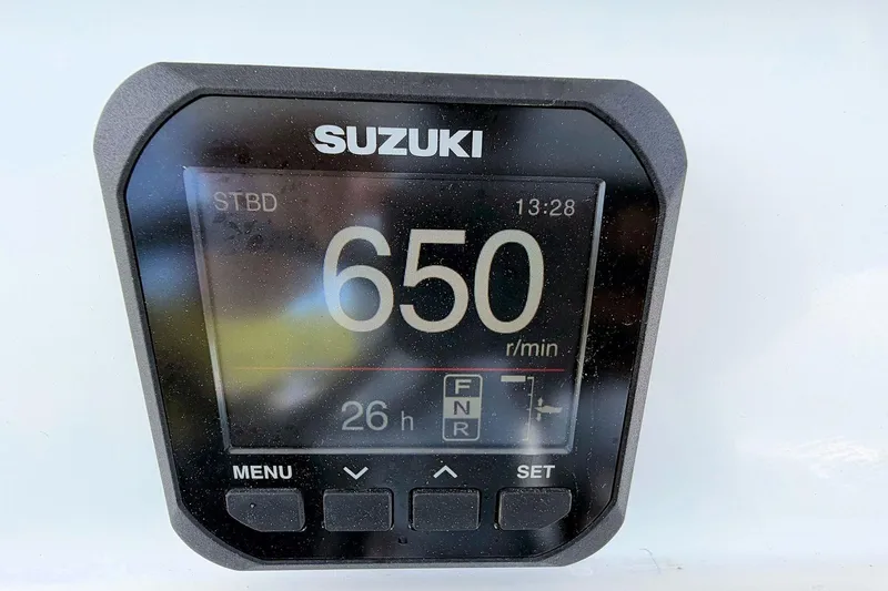 Slide: The Image of Suzuki engine display showing 650 RPM on a Marlago FS 35 Center Console, 2003 model. - 16