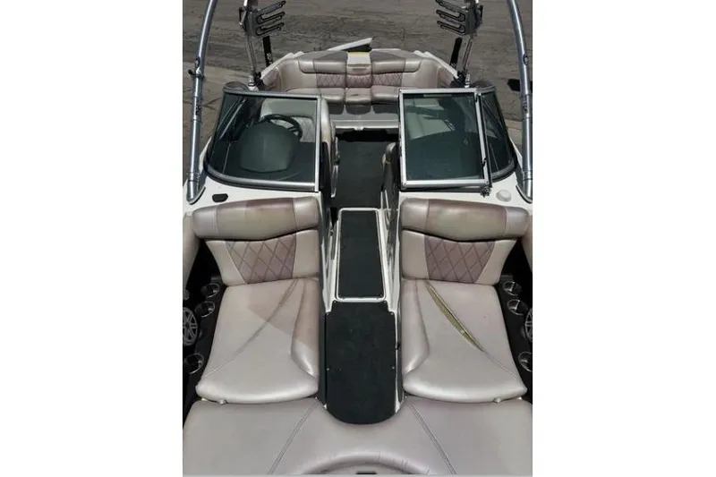 Slide: The Image of 2011 MasterCraft X-45 boat interior with beige seating and open windshield. - 6
