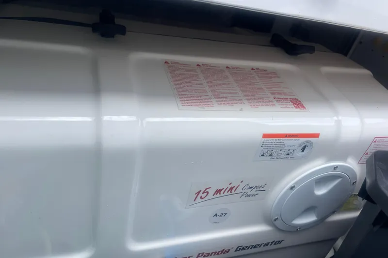 Slide: The Image of Close-up of a Fischer Panda generator on a 2025 HCB 56 Suenos boat. - 16