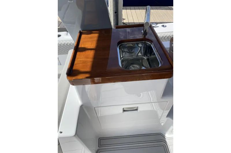 Slide: The Image of Luxury sink area on 2025 HCB 56 Suenos boat with wooden countertop. - 12