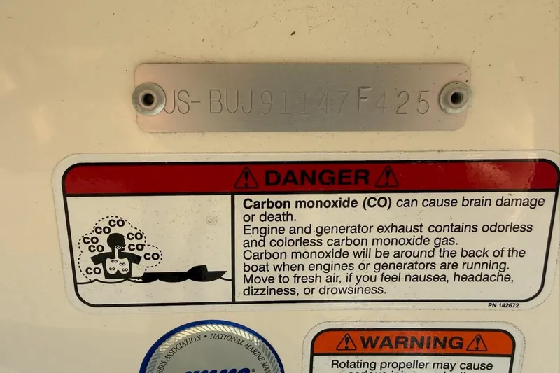 Slide: The Image of 2025 Mako Pro Skiff 15 CC warning label about carbon monoxide dangers. - 14