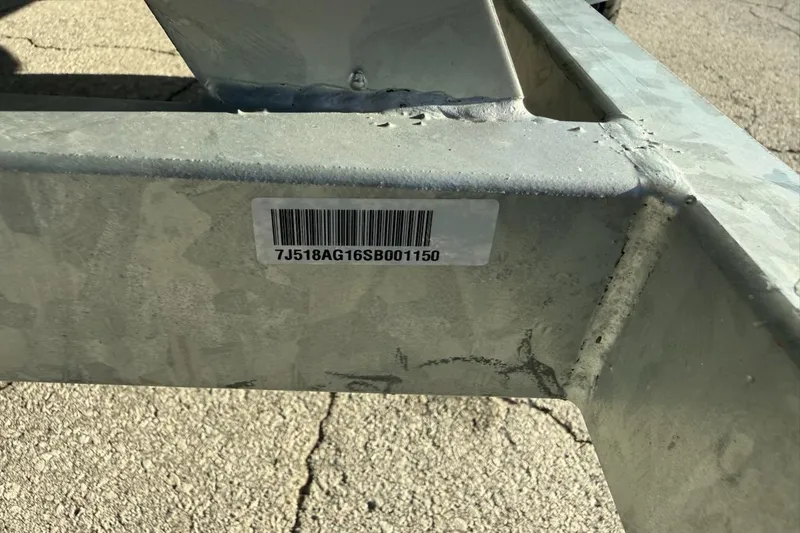 Slide: The Image of Barcode on a metal frame of a 2025 Mako Pro Skiff 15 CC boat. - 16