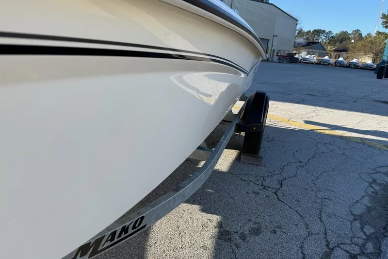 Slide: The Image of 2025 Mako Pro Skiff 15 CC boat on trailer in outdoor setting. - 2