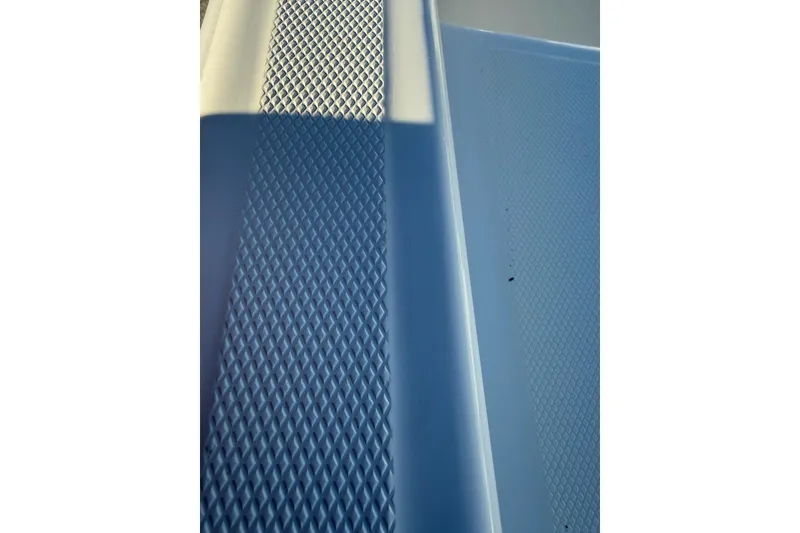 Slide: The Image of Textured deck surface of 2025 Mako Pro Skiff 15 CC boat. - 9