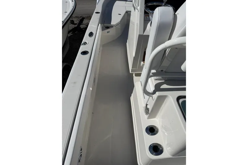 Slide: The Image of 2025 Ranger 2360 Bay boat interior with seating and rod holders. - 10
