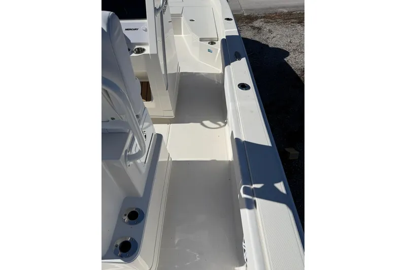 Slide: The Image of 2025 Ranger 2360 Bay boat interior, showcasing sleek white deck and seating area. - 11