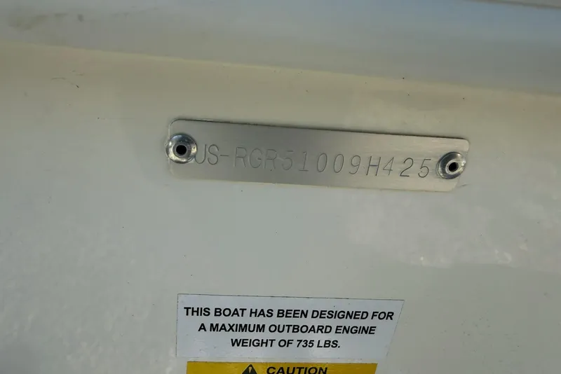 Slide: The Image of 2025 Ranger 2360 Bay boat identification plate and engine weight warning label. - 15