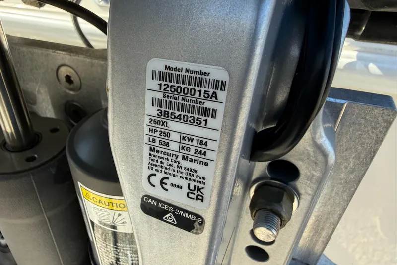 Slide: The Image of Label on a 2025 Ranger 2360 Bay boat engine, showing model and serial numbers. - 16