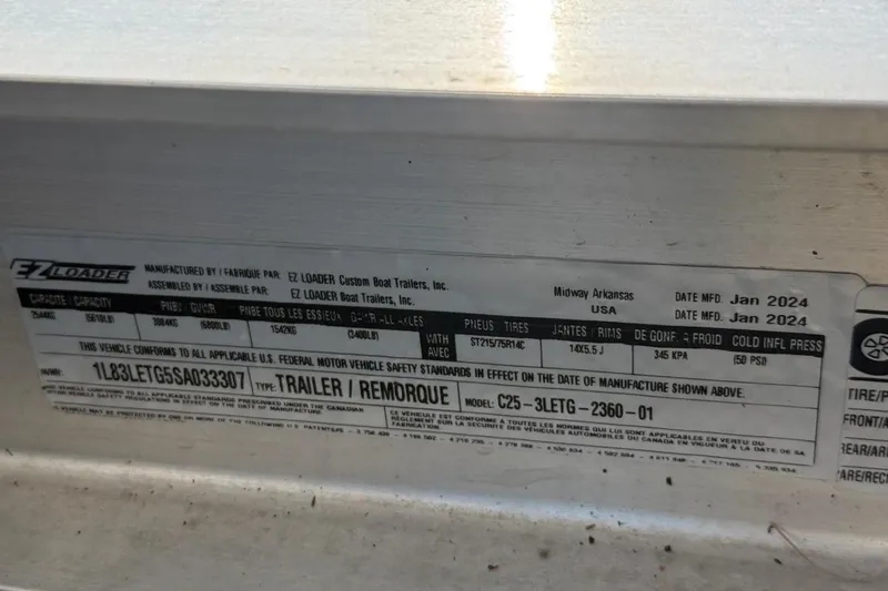 Slide: The Image of Label on EZ Loader trailer, manufactured January 2024, for Ranger 2360 Bay, model 2025. - 17