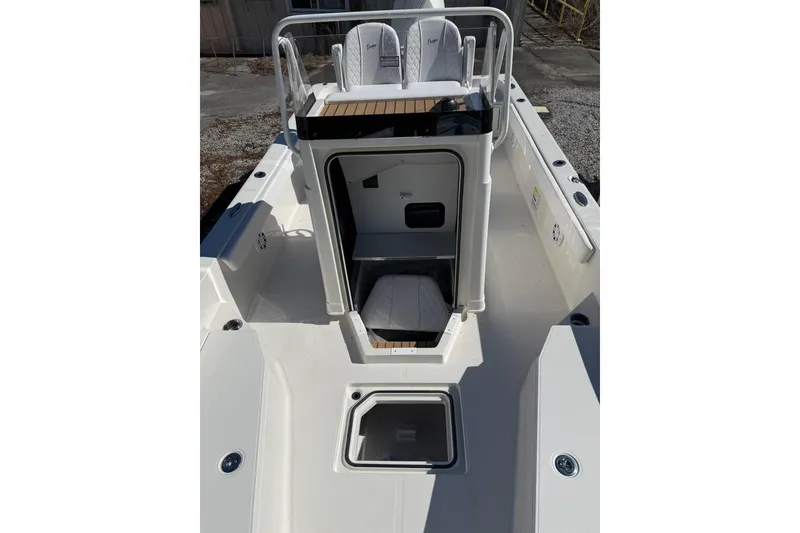 Slide: The Image of 2025 Ranger 2360 Bay boat interior with seating and storage compartments. - 2