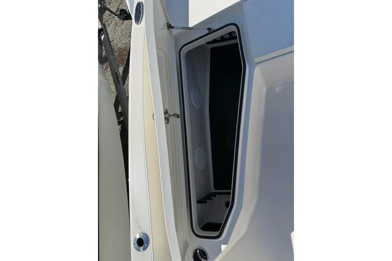 Slide: The Image of Open storage compartment on a 2025 Ranger 2360 Bay boat. - 3
