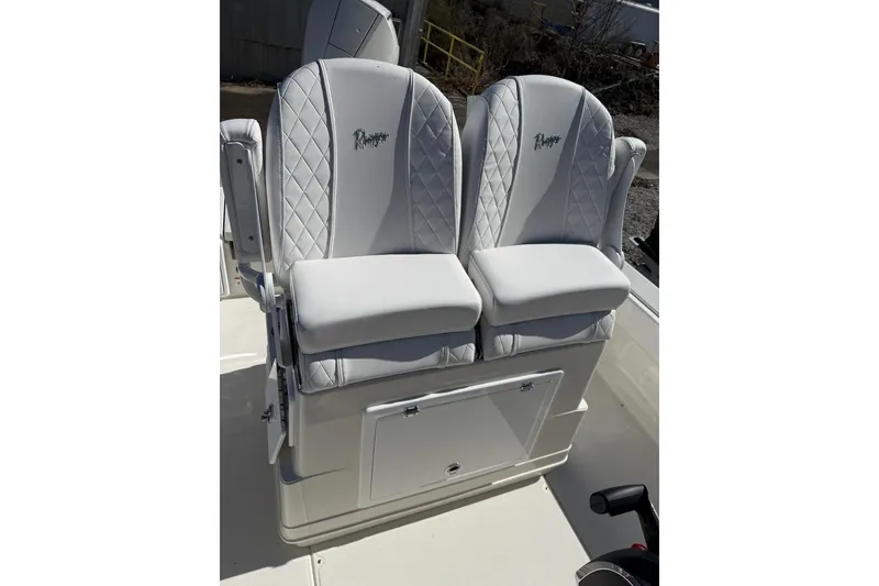 Slide: The Image of Luxury seating on 2025 Ranger 2360 Bay boat, featuring quilted white upholstery. - 6
