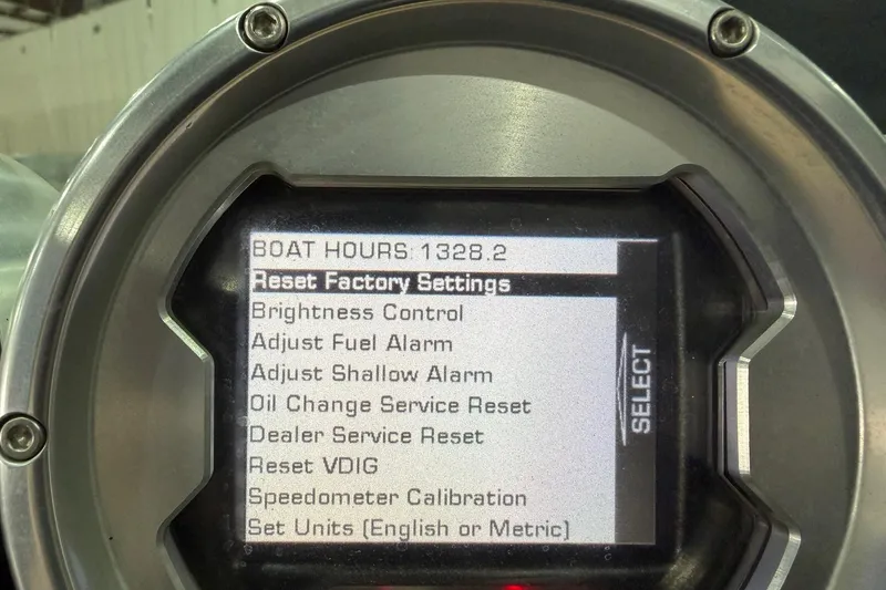 Slide: The Image of 2008 MasterCraft X-35 dashboard display showing boat hours and settings menu. - 11