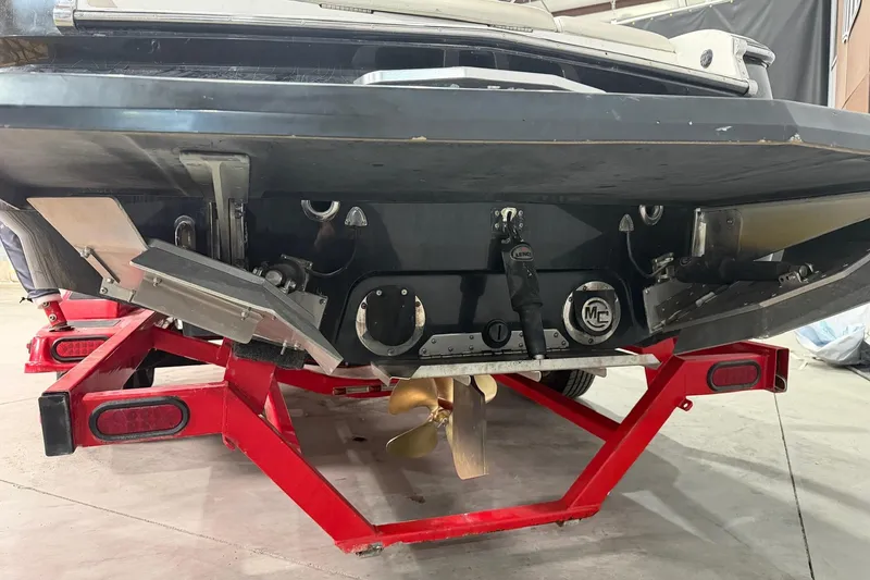 Slide: The Image of Rear view of a 2008 MasterCraft X-35 boat on a red trailer. - 13