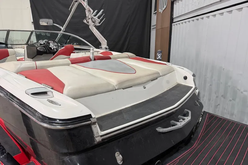 Slide: The Image of 2008 MasterCraft X-35 boat interior with red and white seating, sleek design. - 4