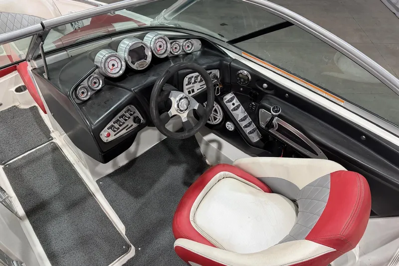 Slide: The Image of 2008 MasterCraft X-35 boat interior with steering wheel and dashboard controls. - 8