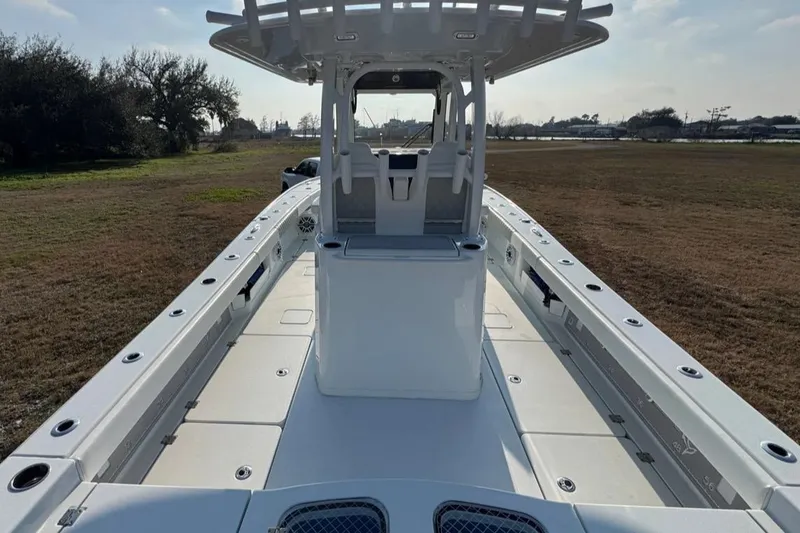 Slide: The Image of 2023 Freeman 28 boat, spacious deck, center console, outdoor setting. - 10