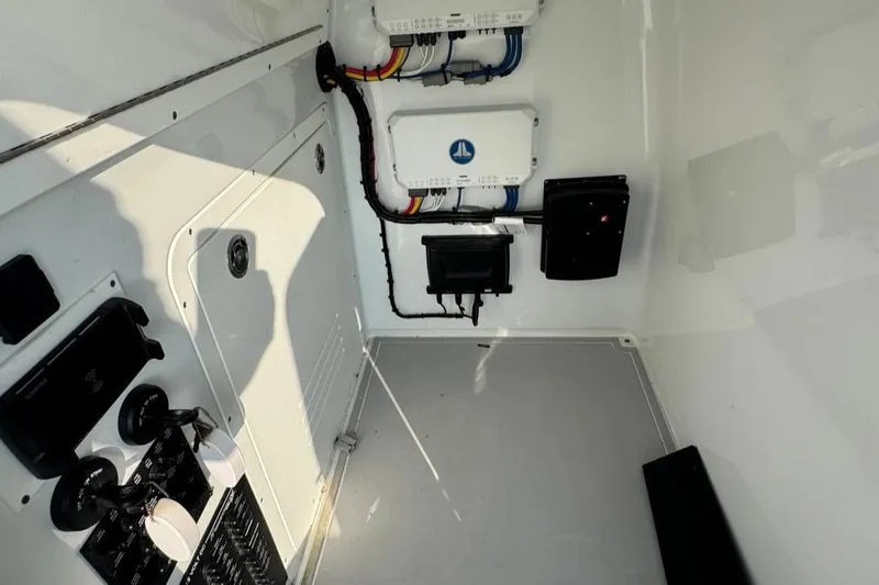 Slide: The Image of Interior view of a 2023 Freeman 28 boat's electrical panel and wiring setup. - 16
