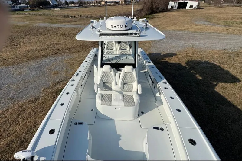 Slide: The Image of 2023 Freeman 28 boat with Garmin equipment, featuring spacious seating and sleek design. - 9