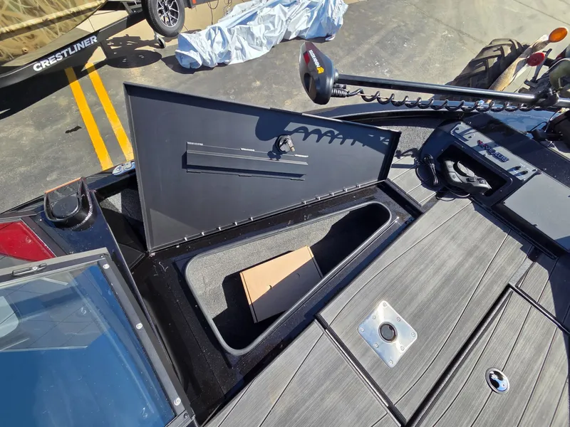 Slide: The Image of Vexus Boats ADX190 2026 with open storage compartment and accessories. - 12