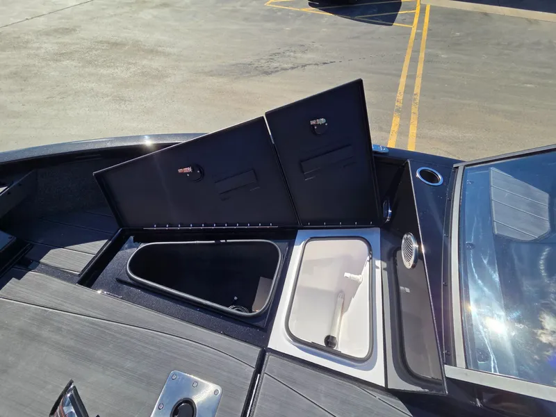 Slide: The Image of Vexus Boats ADX190 2026 with open storage compartments on deck. - 13