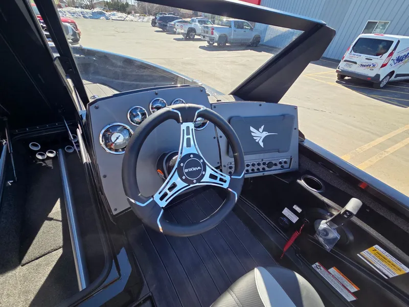 Slide: The Image of Interior view of 2026 Vexus Boats ADX190 cockpit with steering wheel and instruments. - 19