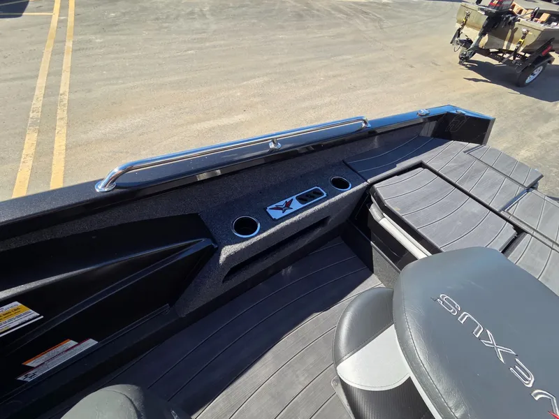 Slide: The Image of Interior of 2026 Vexus Boats ADX190 featuring seating area and cup holders. - 27