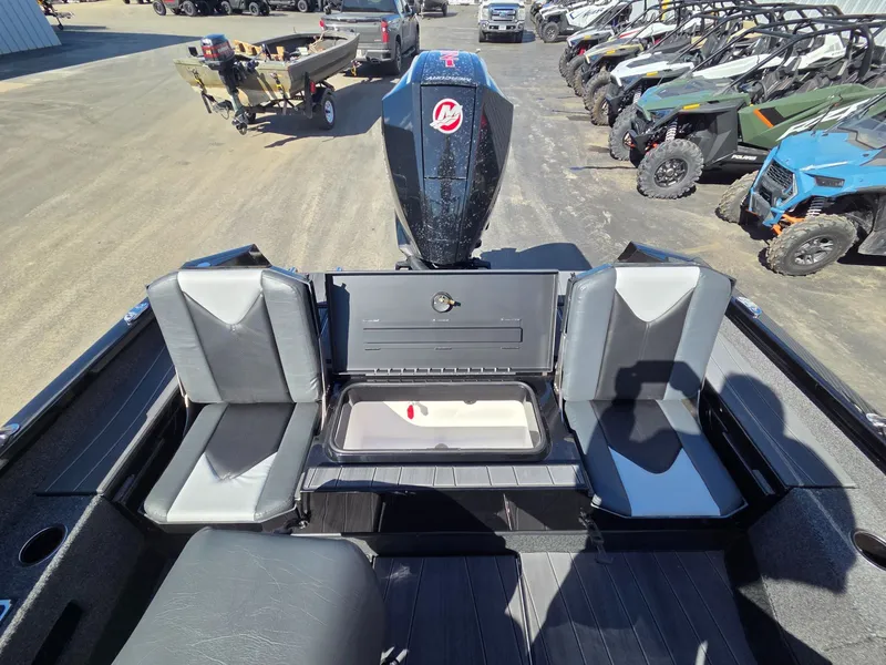 Slide: The Image of 2026 Vexus Boats ADX190 with seating area and motor, surrounded by off-road vehicles. - 30