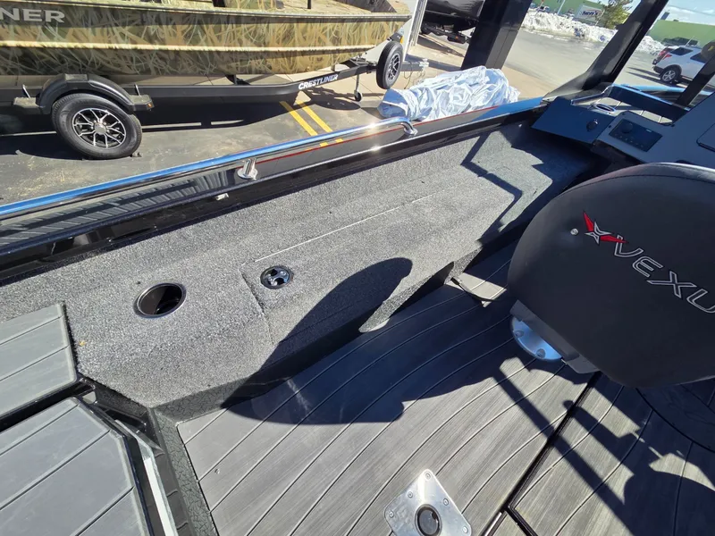 Slide: The Image of Interior of a 2026 Vexus Boats ADX190 with gray carpet flooring. - 36