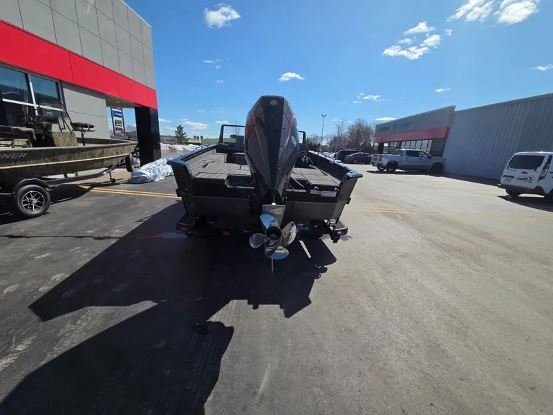 Slide: The Image of Rear view of a 2026 Vexus Boats ADX190 on a parking lot. - 4