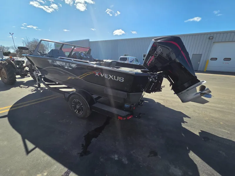 Slide: The Image of 2026 Vexus Boats ADX190 with outboard motor on trailer. - 5